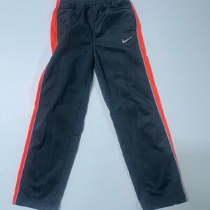 Nike Kids Black Joggers with Red Stripes